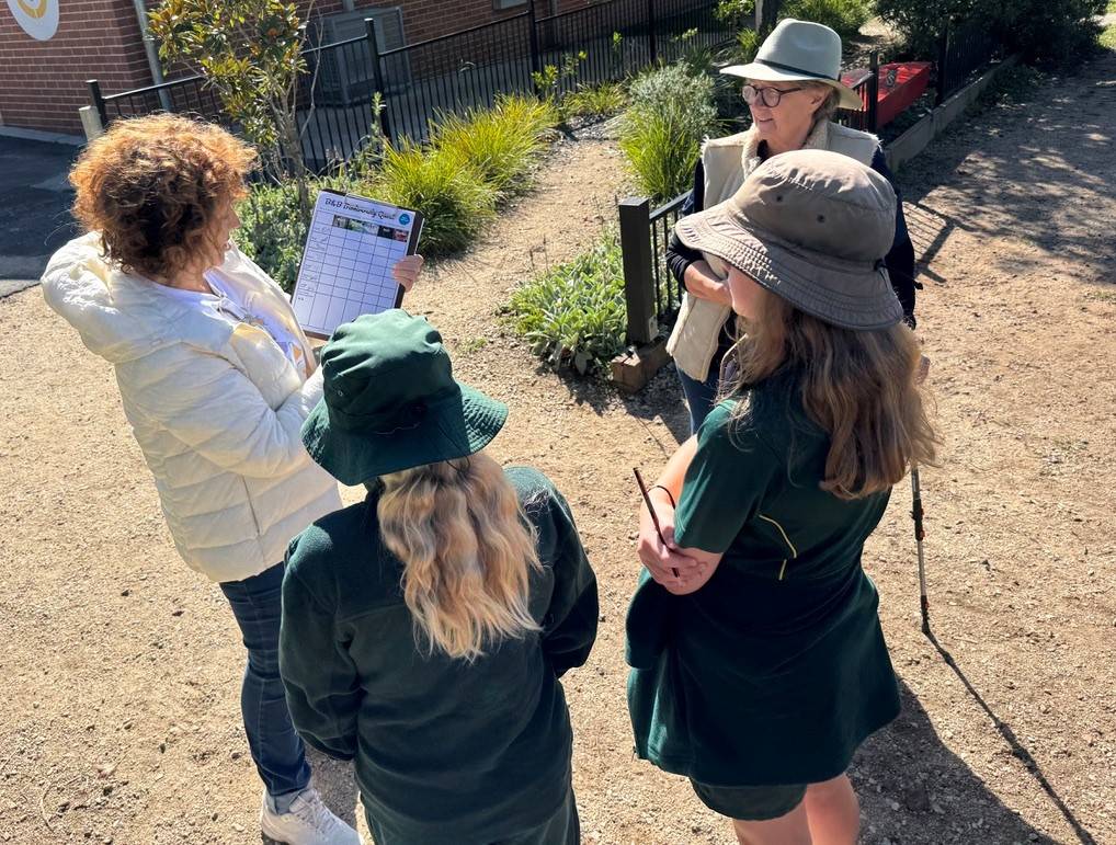 Dr Judy Friedlander (left) explaining how to record insects